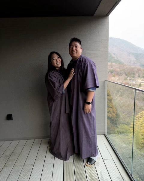 Couple in ryokan robes near a mountain view in Hakone