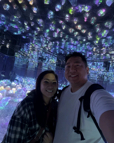 Couple inside a glowing teamLab installation in Kyoto
